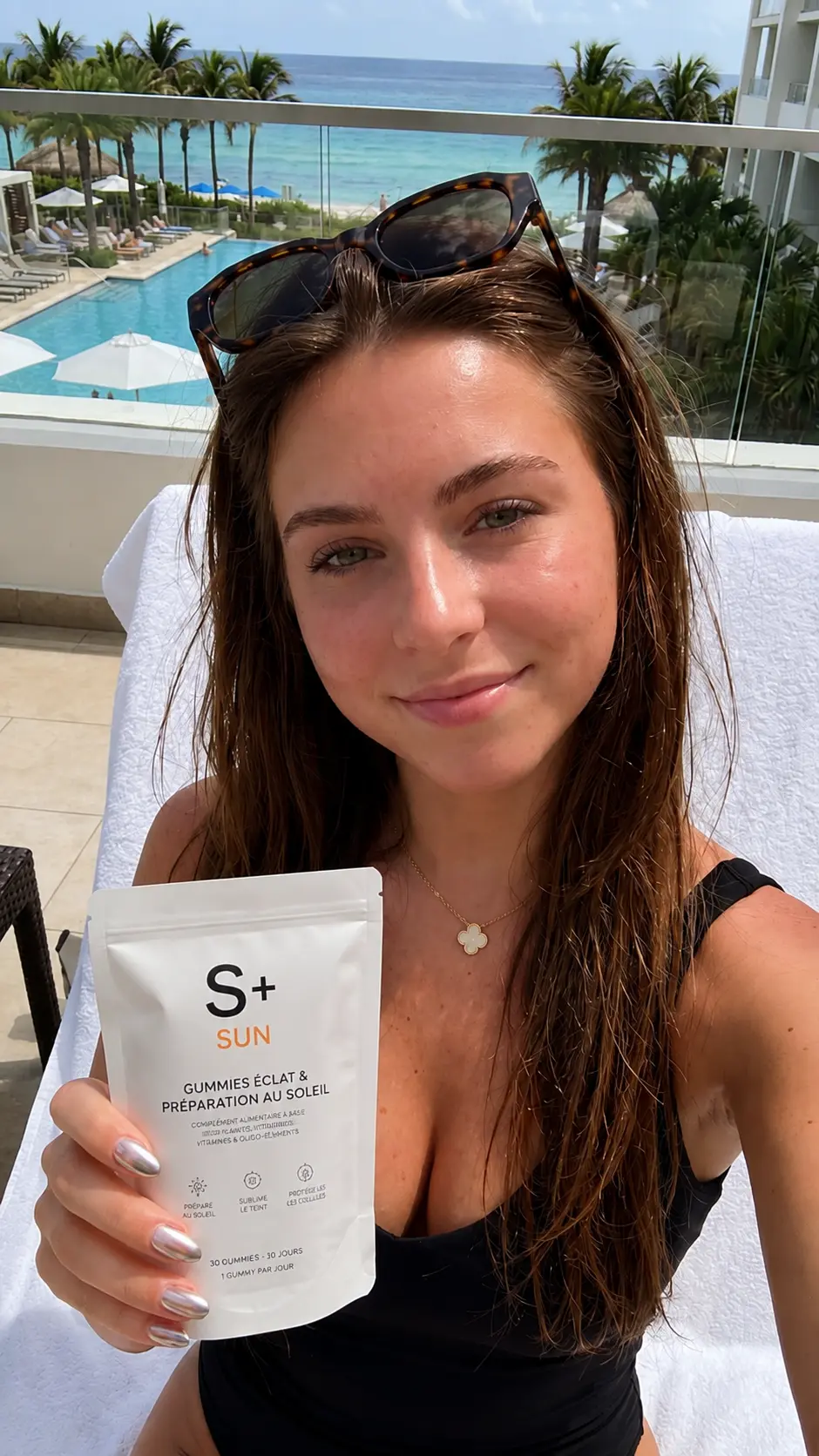 S+ customer by the pool with the S+ SUN pouch