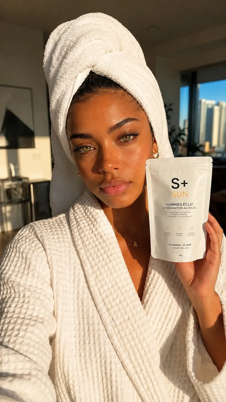S+ customer in a bathrobe with the S+ SUN pouch