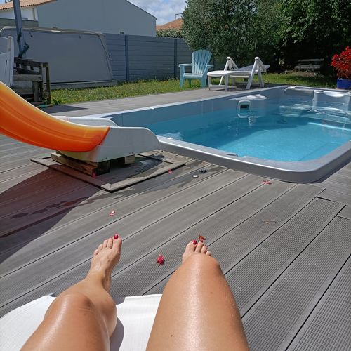 Tanned customer by her pool